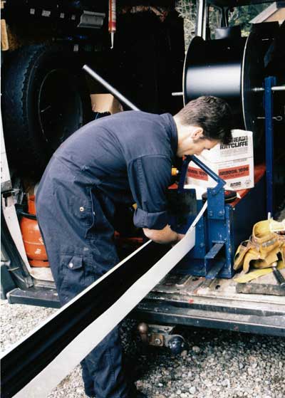 The gutter being measured to exact length needed